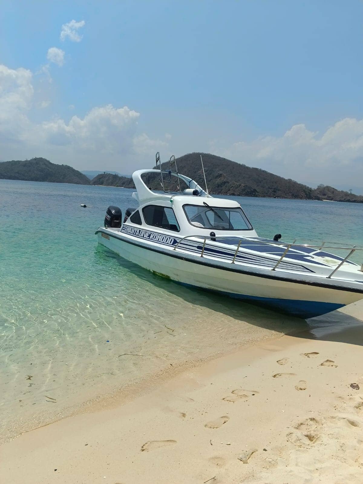 Boats docked at Labuan Bajo harbor ready for Komodo dive trips